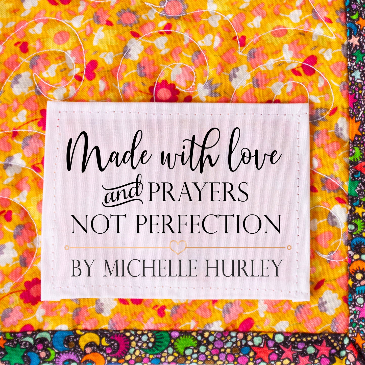 Personalized quilt label reading Made with Love and Prayers Not Perfection with custom maker name Michelle Hurley sewn onto colorful quilt
