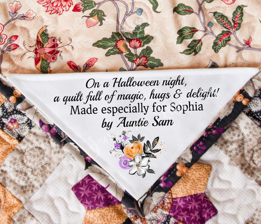 On a Halloween night, a quilt full of magic, hugs, and delight!. 5 x 5" Corner Quilt Label - Jammin Threads