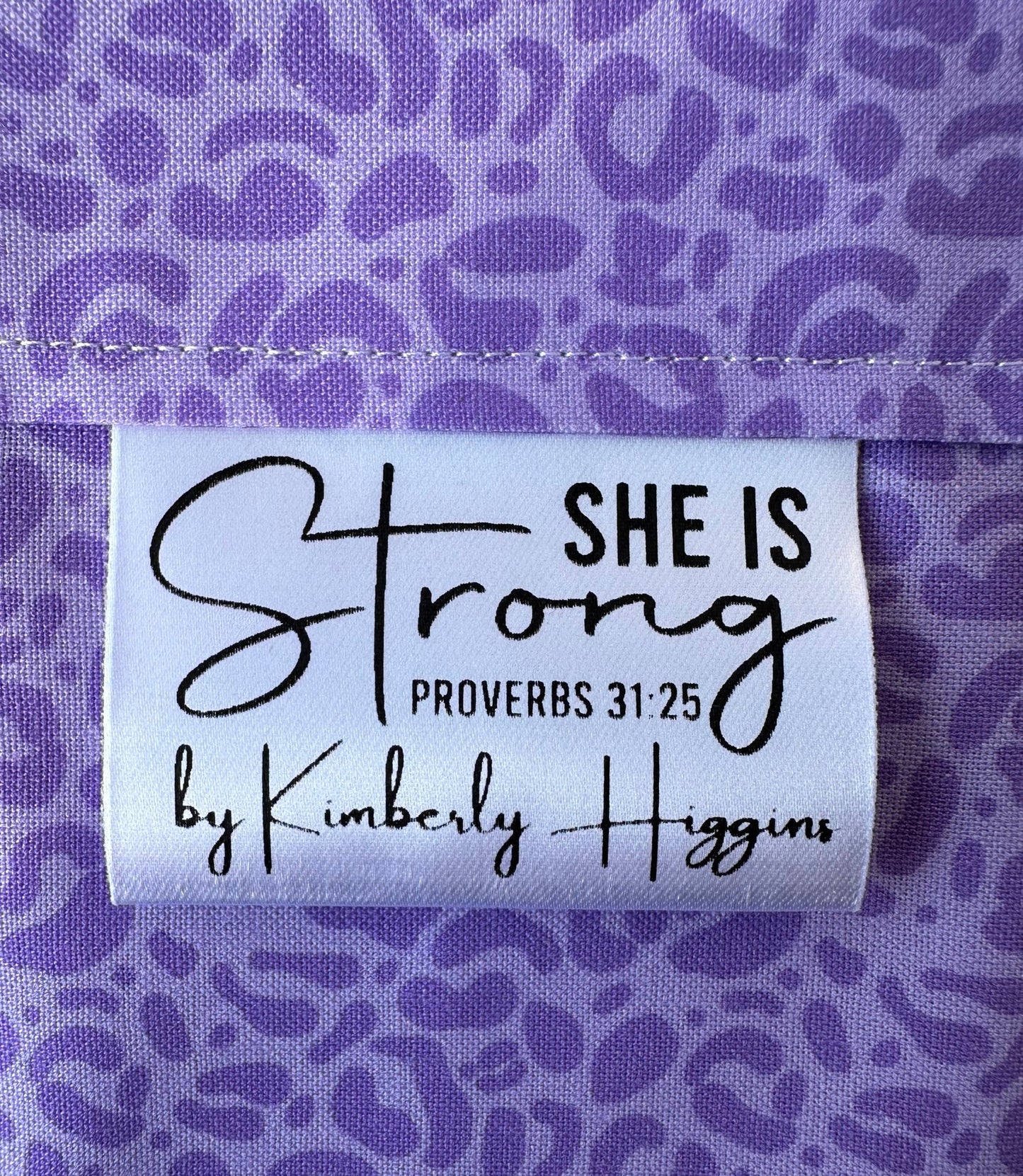 She is Strong. Proverbs 31:25 Christian Satin Labels and Tags - Jammin Threads