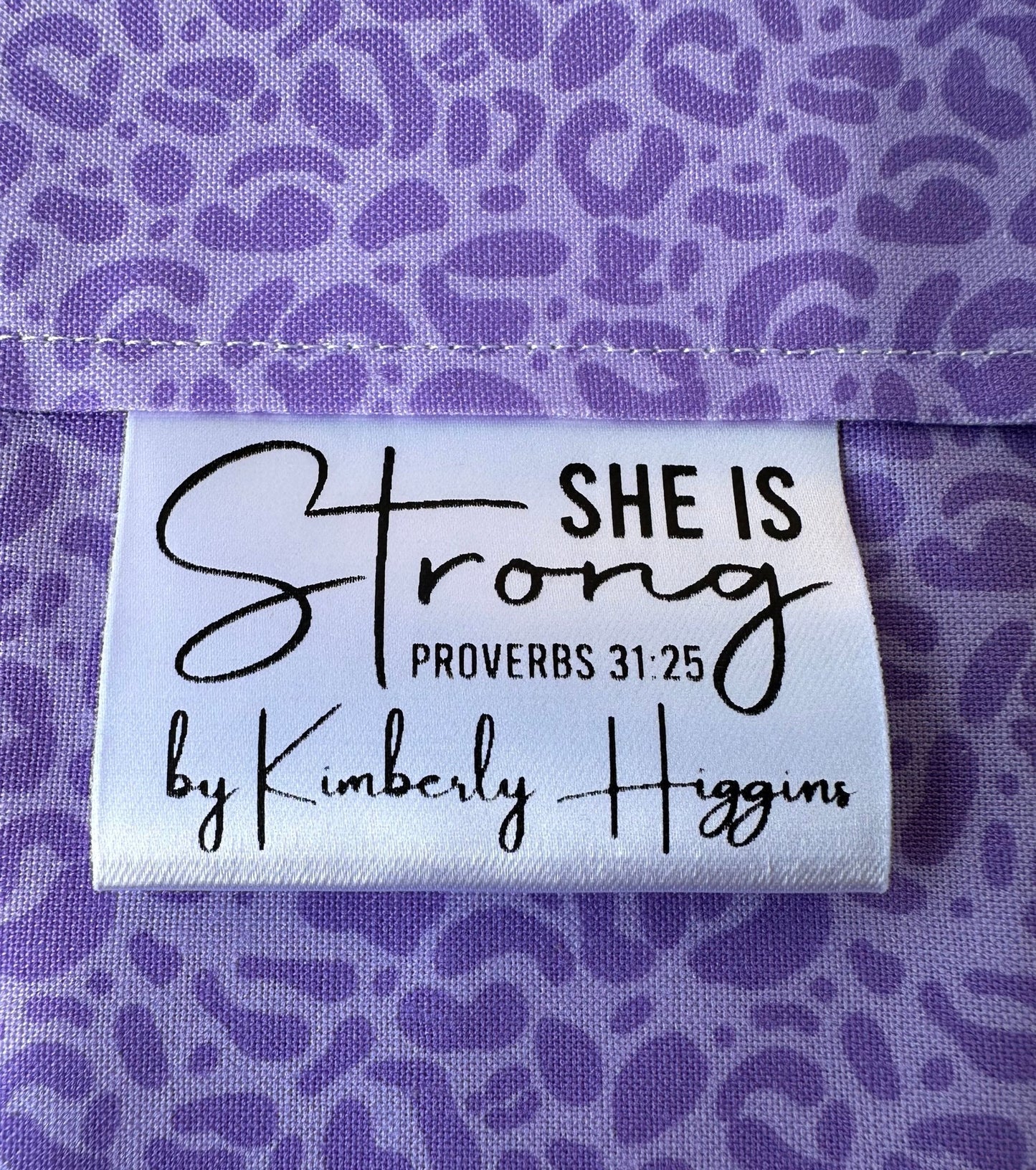 She is Strong. Proverbs 31:25 Christian Satin Labels and Tags - Jammin Threads