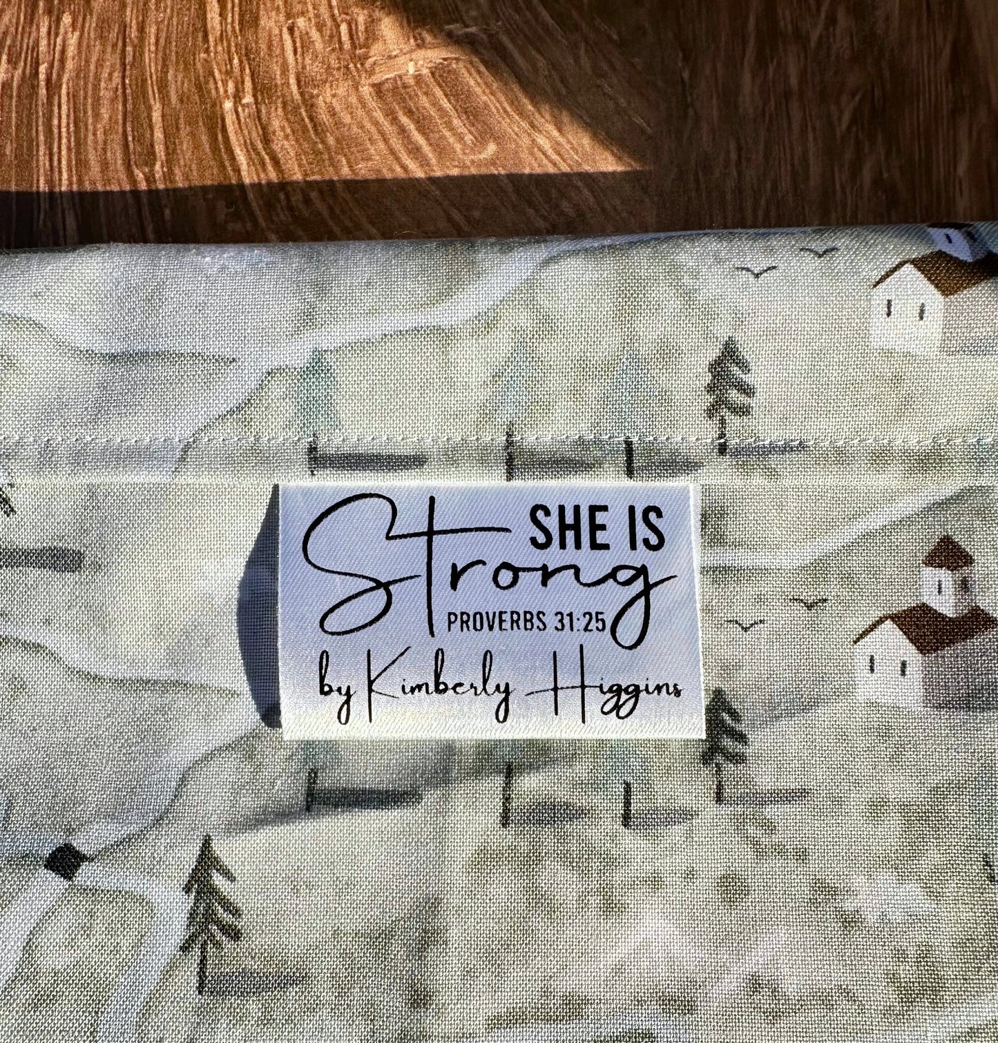She is Strong. Proverbs 31:25 Christian Satin Labels and Tags - Jammin Threads