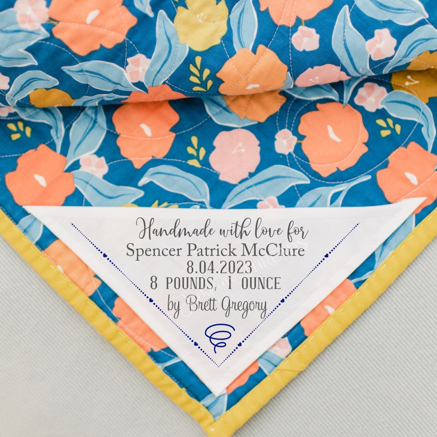 Corner quilt label personalized with baby's birth information. Birth announcement quilt label - Jammin Threads