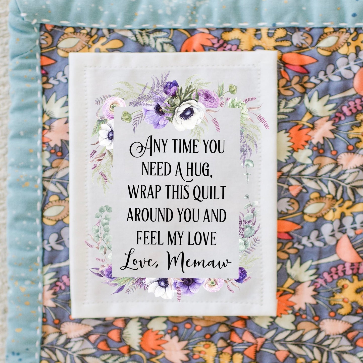 Anytime you need A hug, wrap this quilt around you and feel my love. Personalized quilt labels in a purple floral frame on cotton or polyester - Jammin Threads