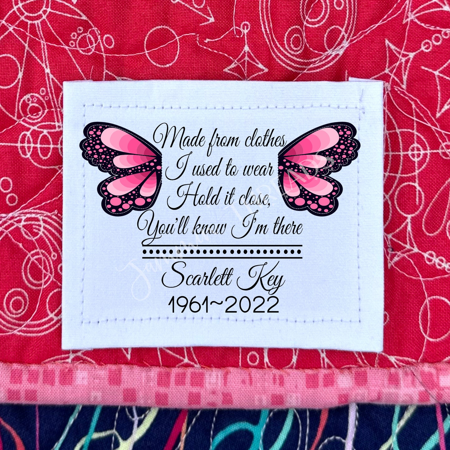 Memory quilt labels with pink butterfly wings.