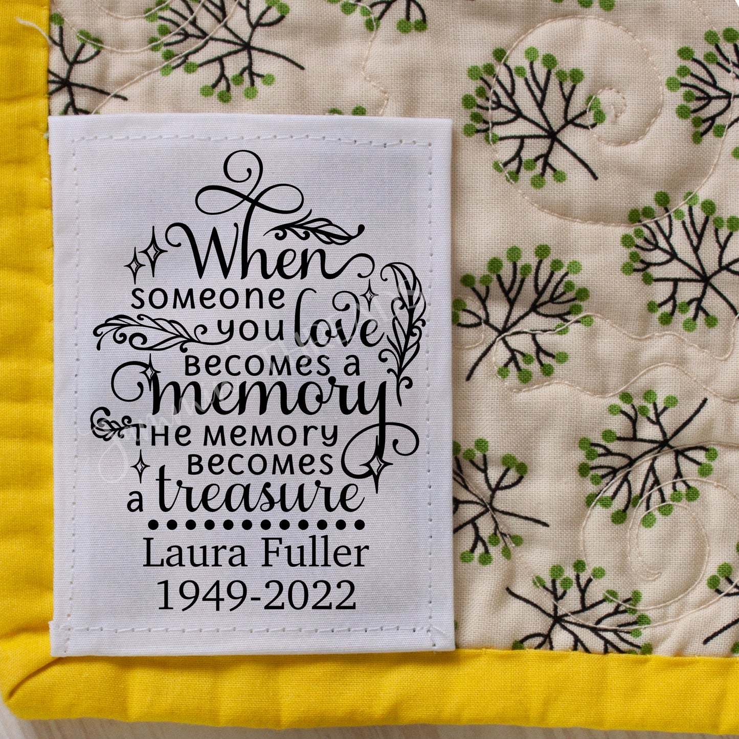 Memory quilt label personalized with name and years.