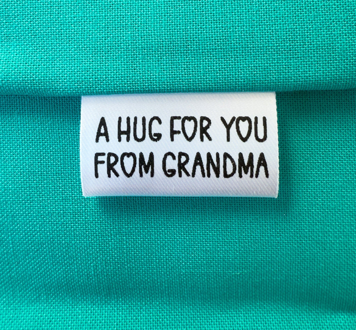 “A Hug for You” Tiny Personalized Satin Quilt Tag • 1" x 0.5" • Add Maker’s Name - Jammin Threads