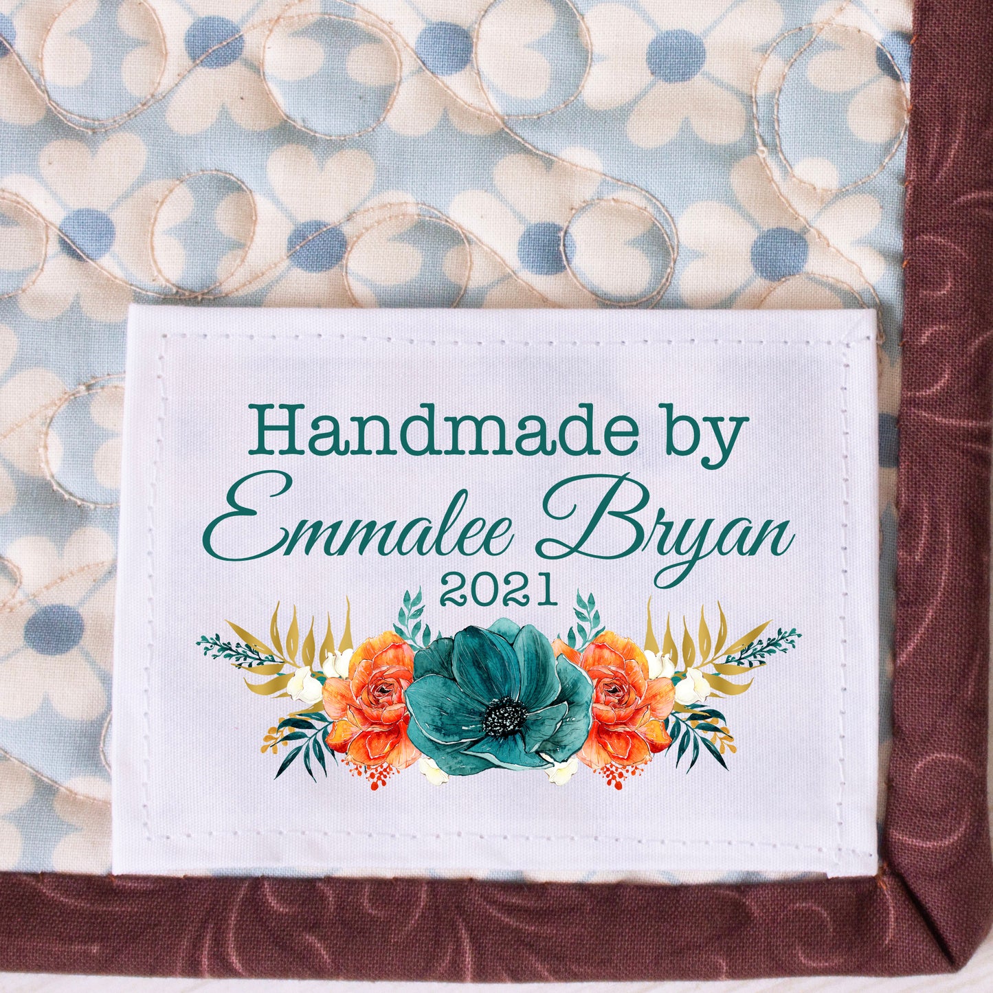 Floral quilt labels in emerald green and orange. Personalized quilt labels with the maker's name