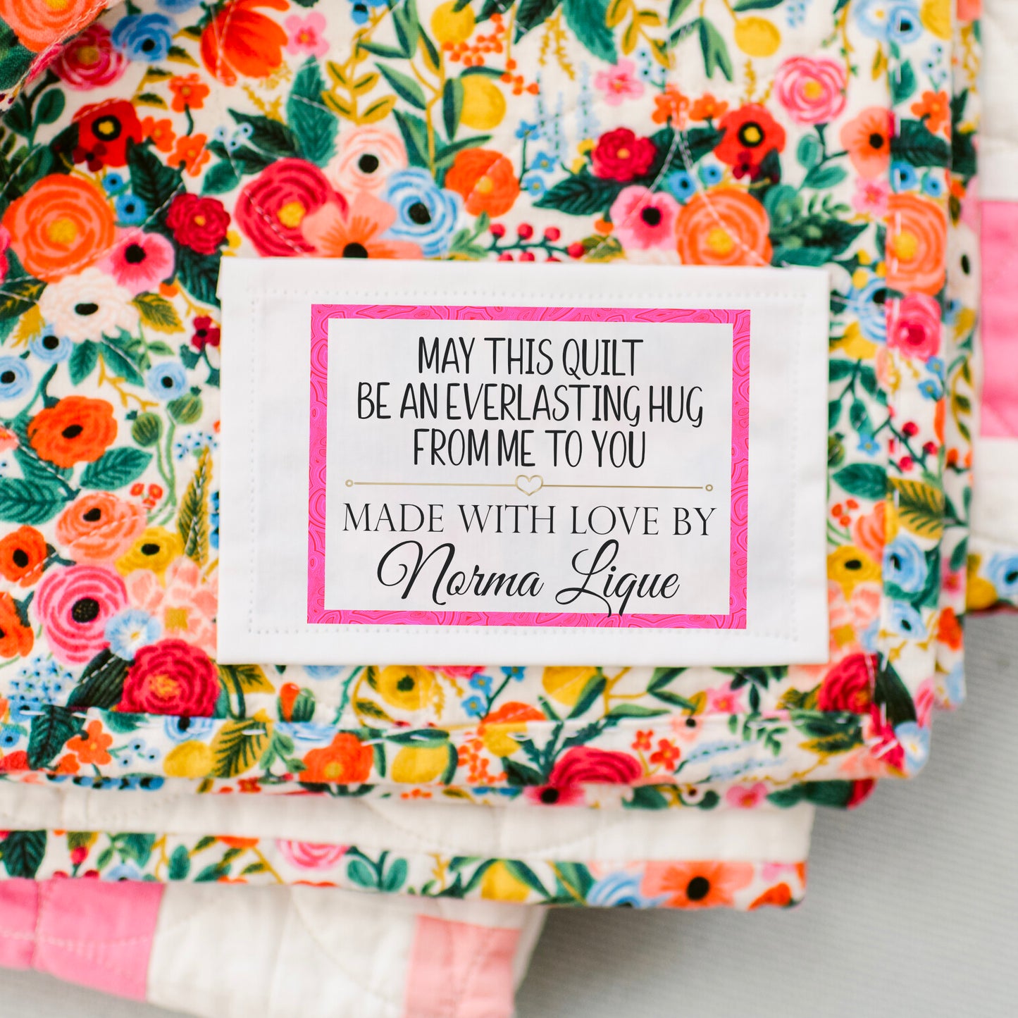 May this Quilt be An Everlasting Hug from Me to You. Handmade quilt labels with a pink border