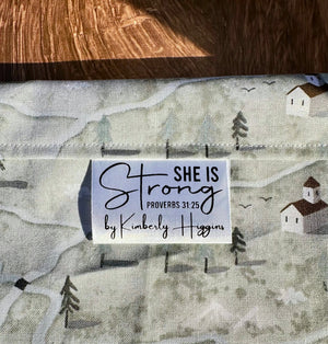 She is Strong. Proverbs 31:25 Christian Satin Labels and Tags - Jammin Threads