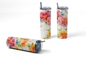Floral quilt design 20 oz skinny tumbler with stitched quilt texture pattern shown with lid and stainless steel straw.
